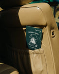 Earl of East Smoke & Musk air freshener hanging in a car