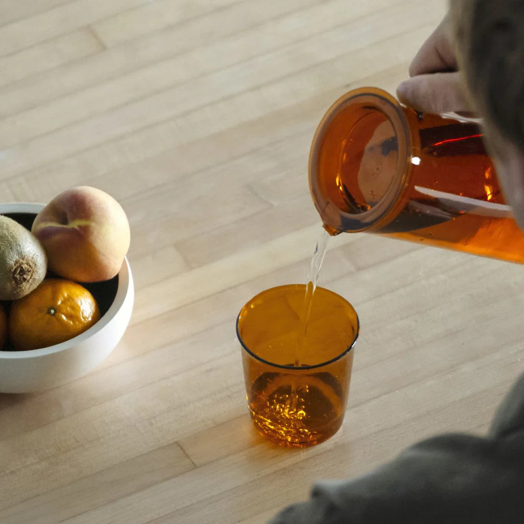KINTO Cast Amber Glass in use on a table