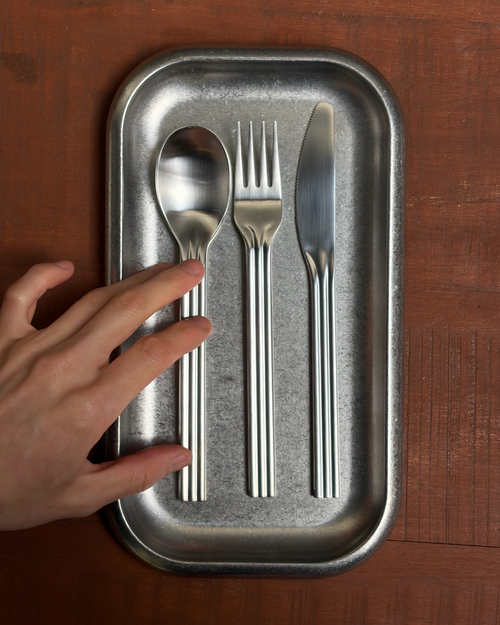 Service Projects tableware and cutlery laid out on a table